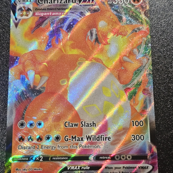 Pokemon Charizard VMAX Card - Vibrant Orange and Yellow Games
